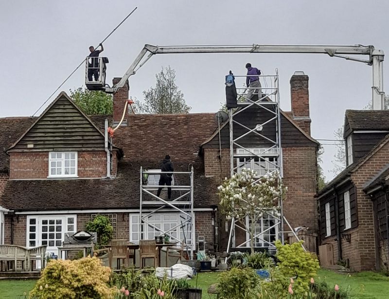 The Roof Moss Cleaners using cherry picker and scaffolding to clean roof safely and professionally in Nailsworth, Gloucestershire