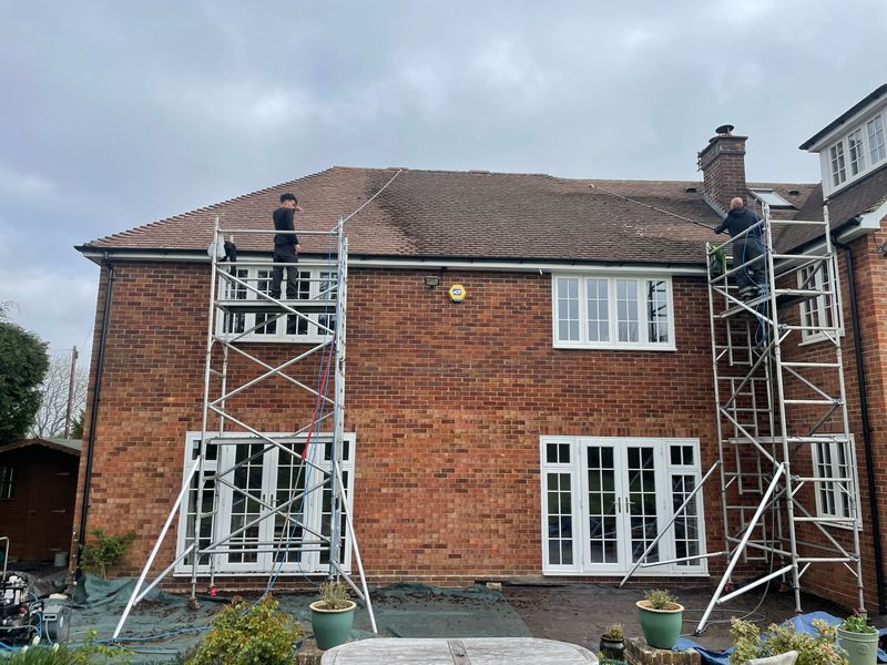 Roof cleaning carried out safely from scaffold towers by The Roof Moss Cleaners in Nailsworth
